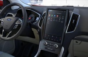 The steering wheel of a Mercedes Benz car is shown.